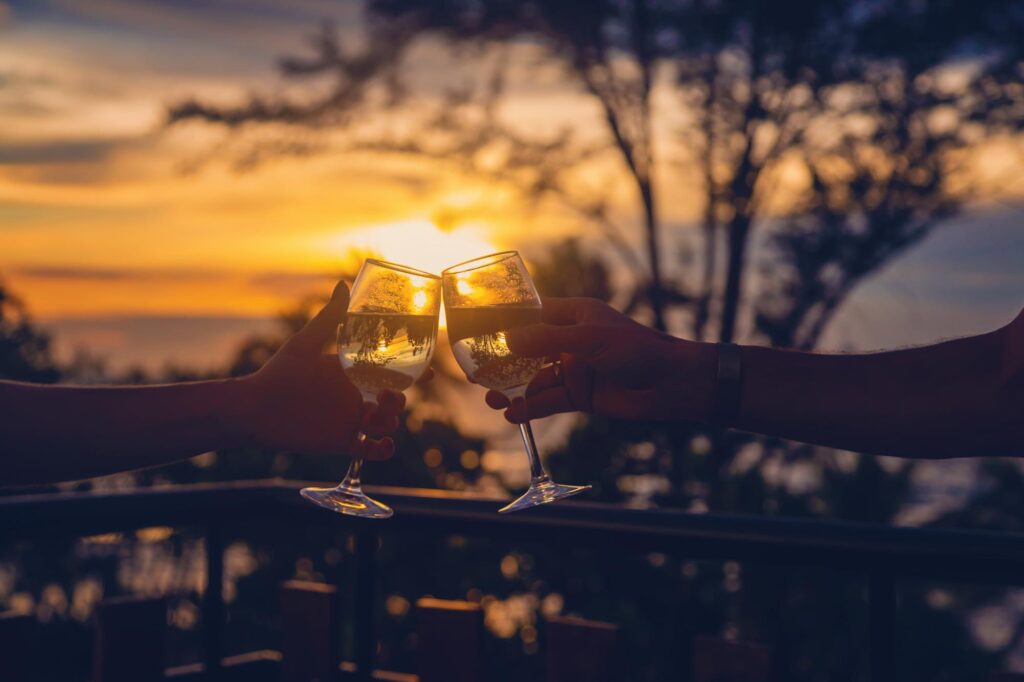 magnific photo two hands holding wine glasses clinking toge 1392