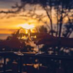 magnific photo two hands holding wine glasses clinking toge 1392